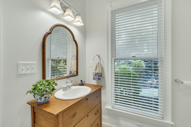 bathroom featuring vanity and a healthy amount of sunlight