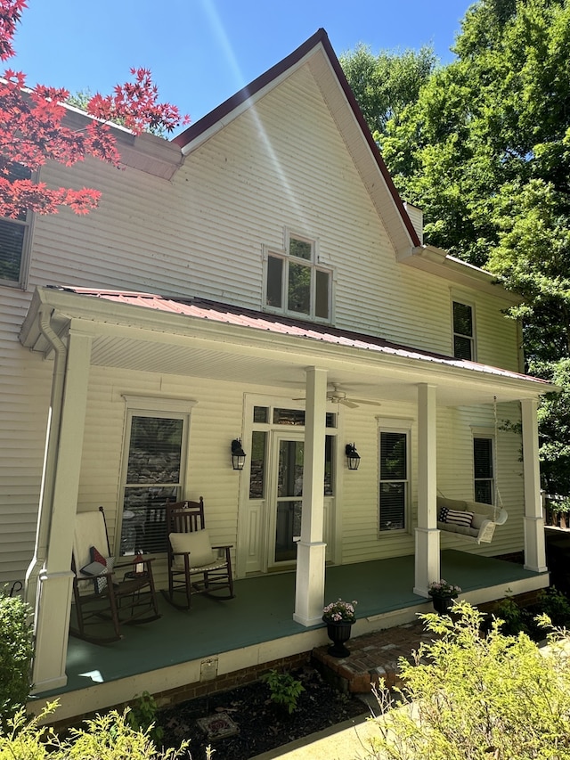 back of house with covered porch