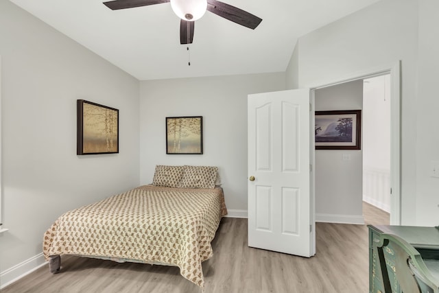 bedroom featuring light hardwood / wood-style floors and ceiling fan