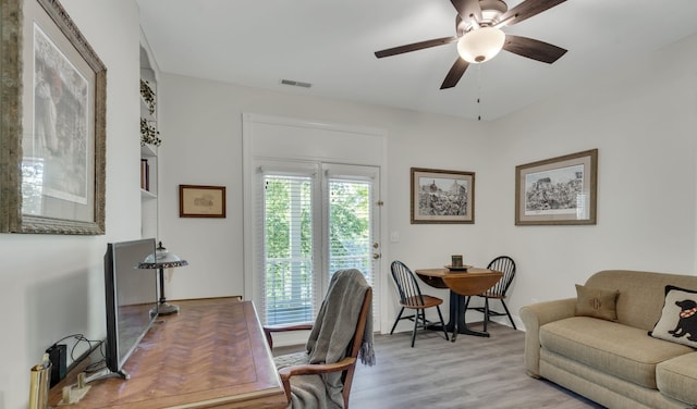 office featuring light wood-type flooring and ceiling fan