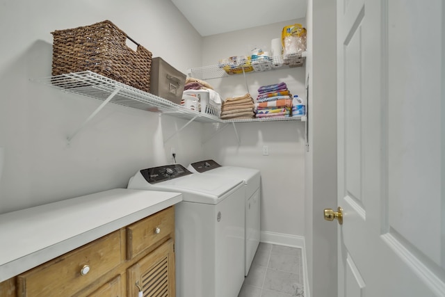 washroom with light tile patterned flooring and washer and clothes dryer