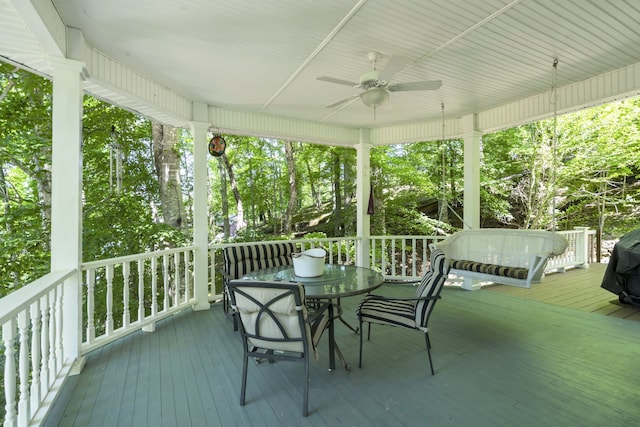 wooden terrace featuring ceiling fan