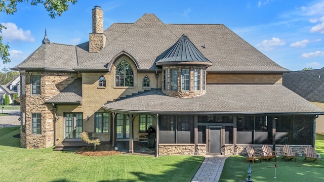 back of property featuring a patio and a yard