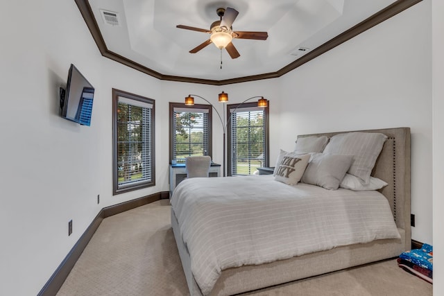 bedroom with multiple windows, crown molding, ceiling fan, and light colored carpet