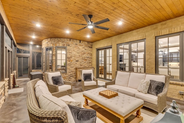 living room featuring concrete flooring, wood ceiling, french doors, and ceiling fan