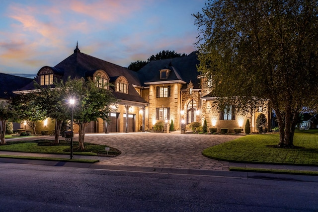 view of front of property with a lawn