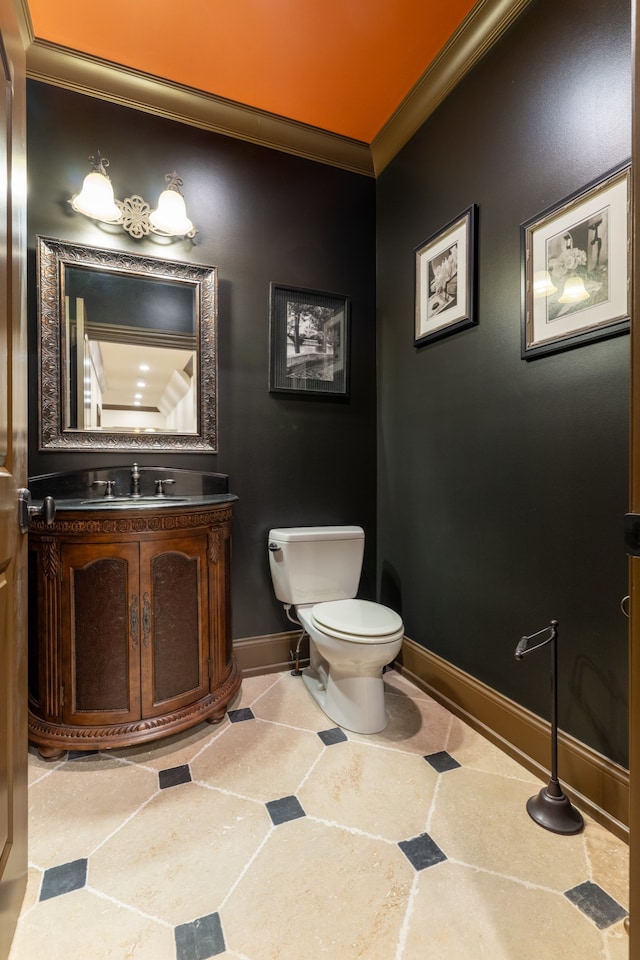 bathroom with ornamental molding, tile patterned floors, vanity, and toilet