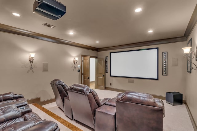 home theater with crown molding and light carpet