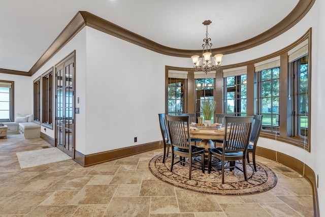 dining area with an inviting chandelier and ornamental molding