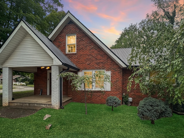 view of front of home featuring a patio and a yard