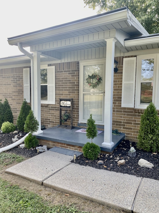 property entrance featuring covered porch