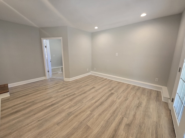 spare room with light hardwood / wood-style flooring