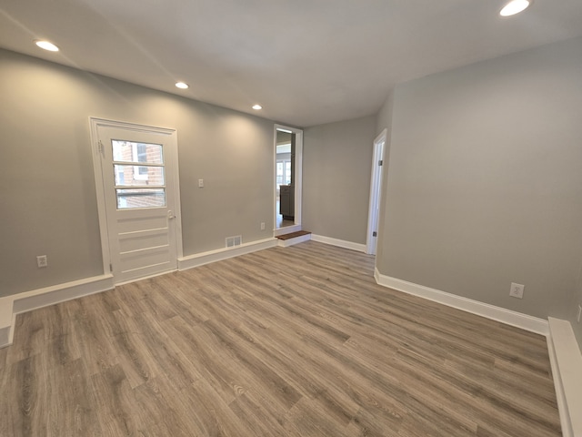 empty room featuring wood-type flooring