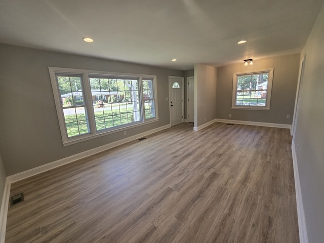 unfurnished living room featuring hardwood / wood-style floors