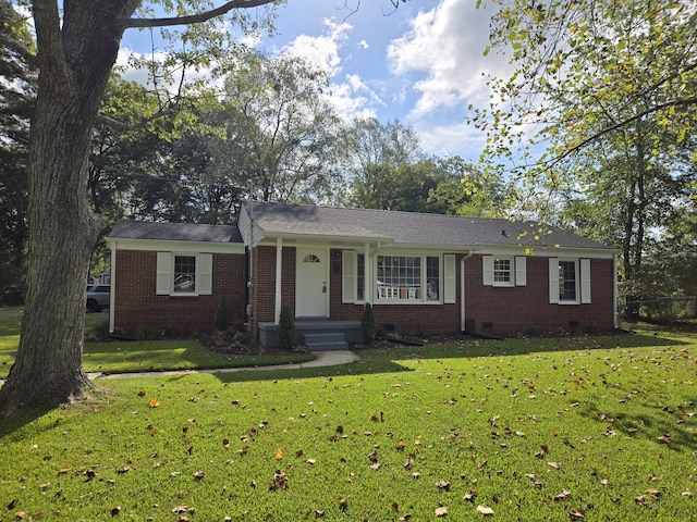 ranch-style home featuring a front yard