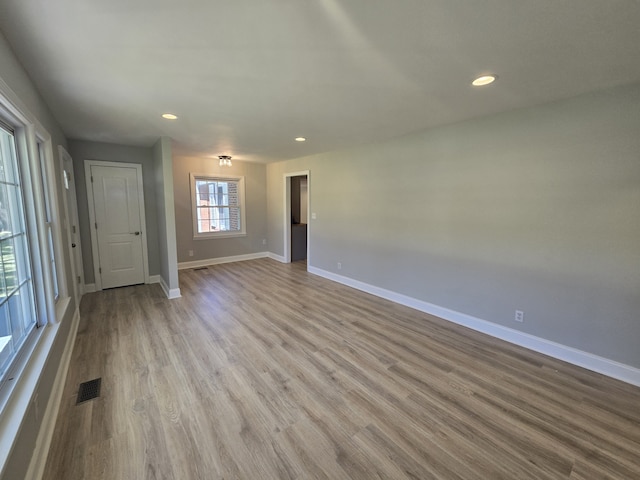 unfurnished living room featuring light wood-type flooring