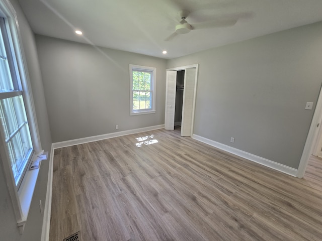 spare room featuring light wood-type flooring and ceiling fan