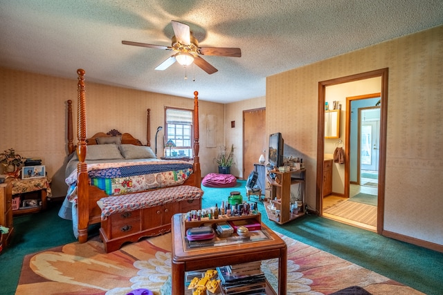 bedroom featuring ceiling fan, carpet floors, and a textured ceiling