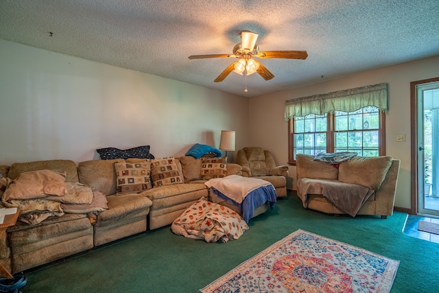 carpeted living room with ceiling fan and a textured ceiling