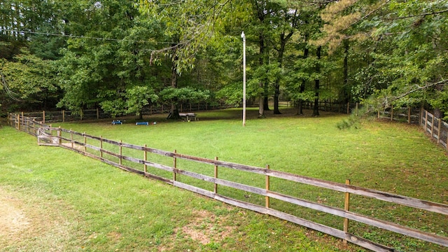 view of yard with a rural view