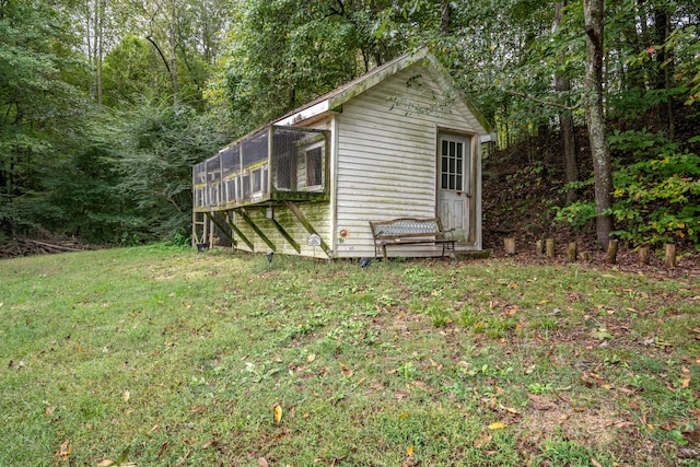 view of property exterior with a sunroom and a yard