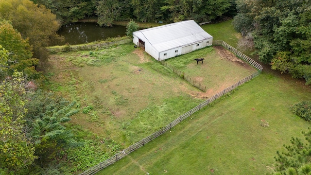 birds eye view of property with a water view and a rural view