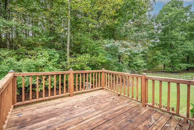 wooden deck with a yard