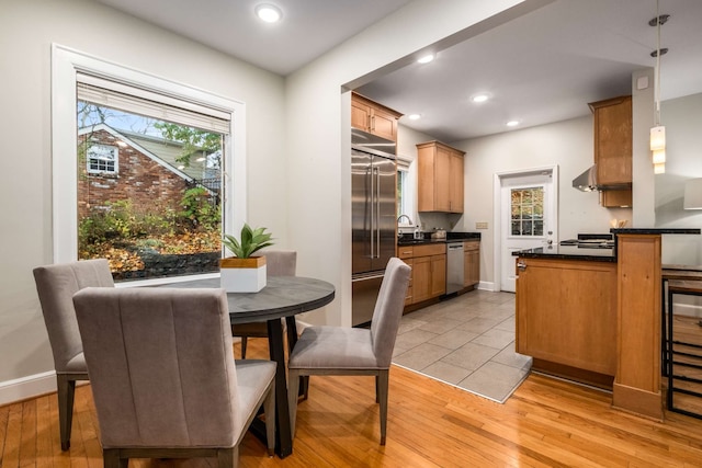 dining area featuring light hardwood / wood-style floors and sink