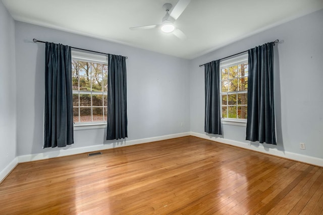 empty room featuring ceiling fan and wood-type flooring