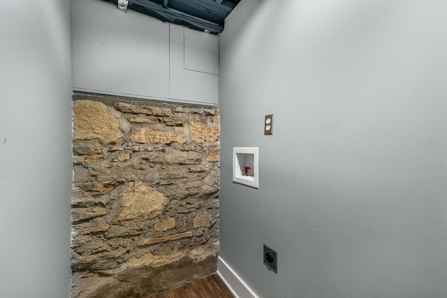 laundry area featuring electric dryer hookup, hookup for a washing machine, and hardwood / wood-style flooring