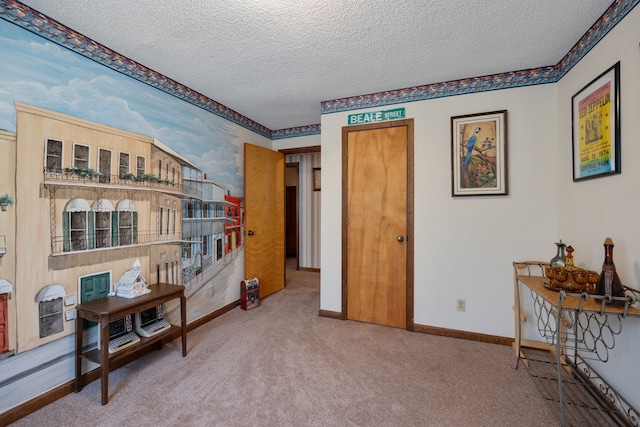 bedroom featuring a textured ceiling and carpet floors