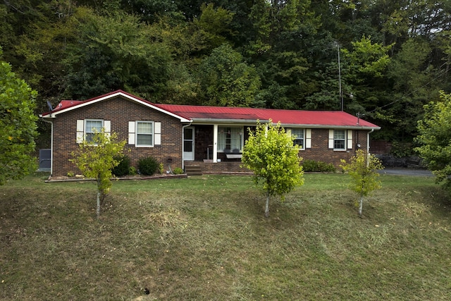 ranch-style home with a front lawn