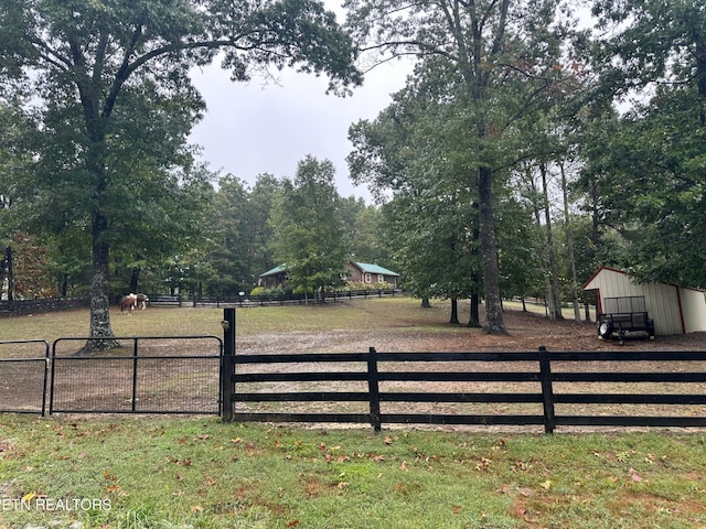 view of gate featuring a yard