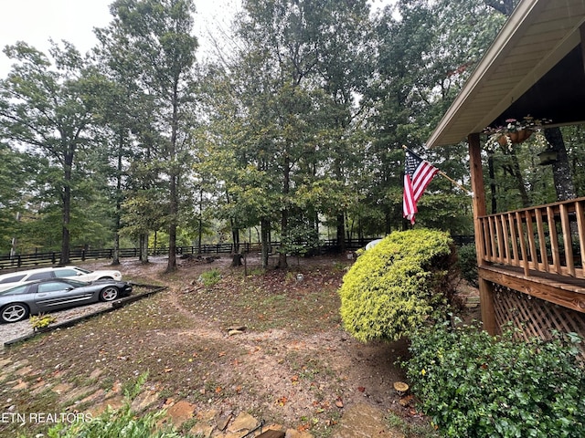 view of yard featuring a wooden deck