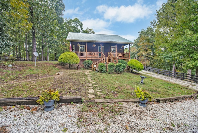 view of front facade with a wooden deck