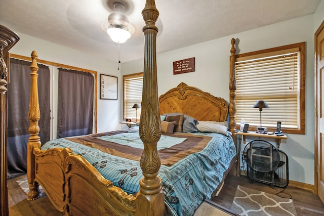 bedroom with ceiling fan and hardwood / wood-style flooring