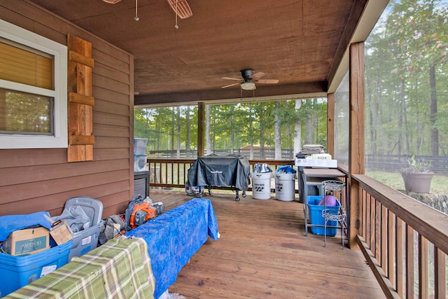 wooden deck with ceiling fan and grilling area