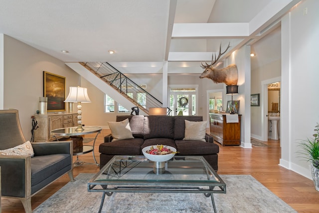 living room with sink and light hardwood / wood-style flooring