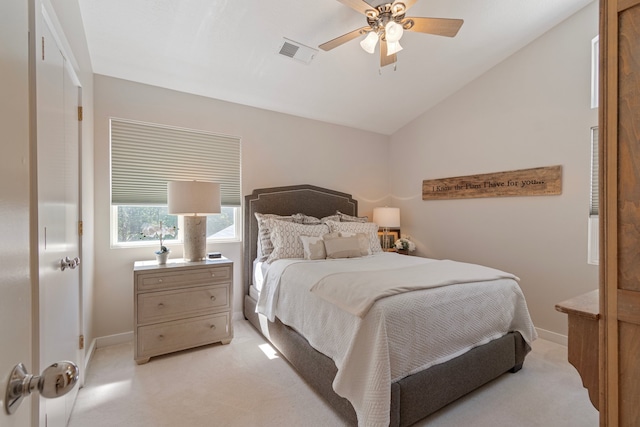 bedroom featuring lofted ceiling, light carpet, and ceiling fan