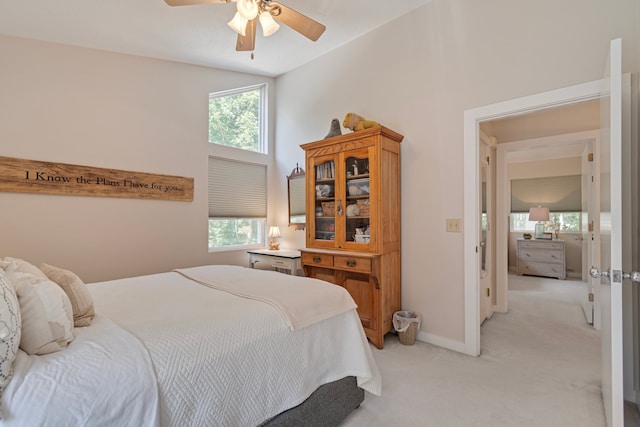 bedroom featuring high vaulted ceiling, light colored carpet, and ceiling fan