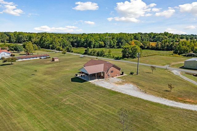 birds eye view of property with a rural view