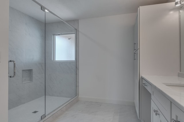 bathroom with walk in shower and vanity