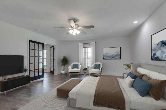 bedroom with ceiling fan, hardwood / wood-style flooring, and french doors