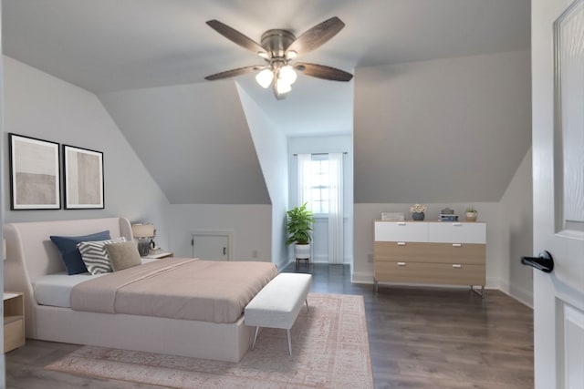 bedroom featuring vaulted ceiling, ceiling fan, and dark hardwood / wood-style flooring