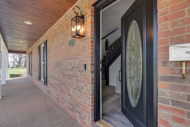 entrance to property featuring covered porch