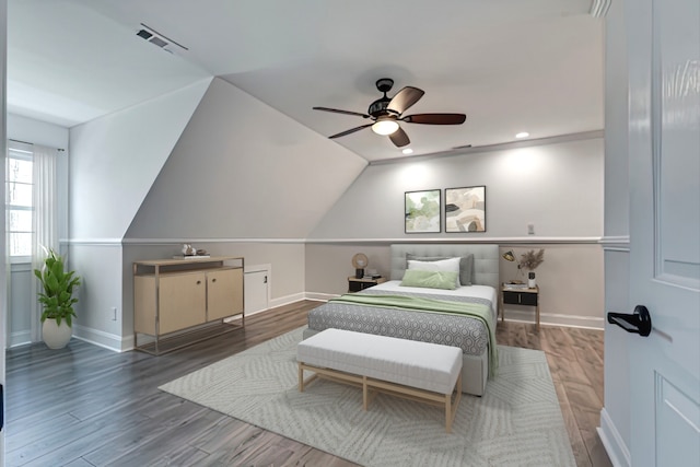 bedroom featuring vaulted ceiling, hardwood / wood-style floors, and ceiling fan