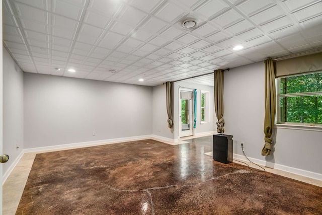 spare room with concrete floors and plenty of natural light