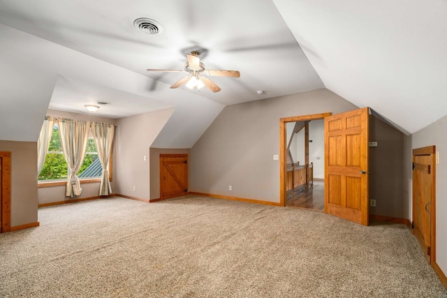 bonus room featuring ceiling fan, carpet floors, and vaulted ceiling