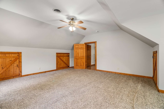 bonus room with ceiling fan, carpet floors, and vaulted ceiling