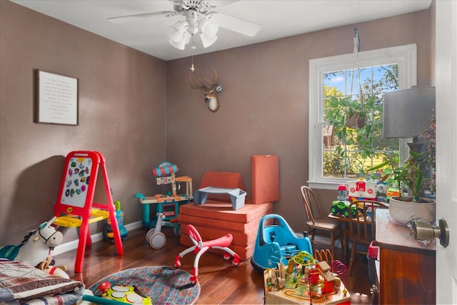 game room featuring ceiling fan and dark wood-type flooring